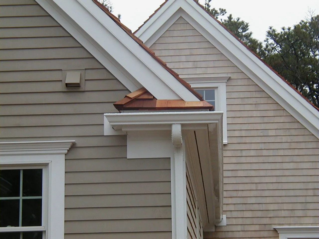 a house with a roof that has a gutter on it